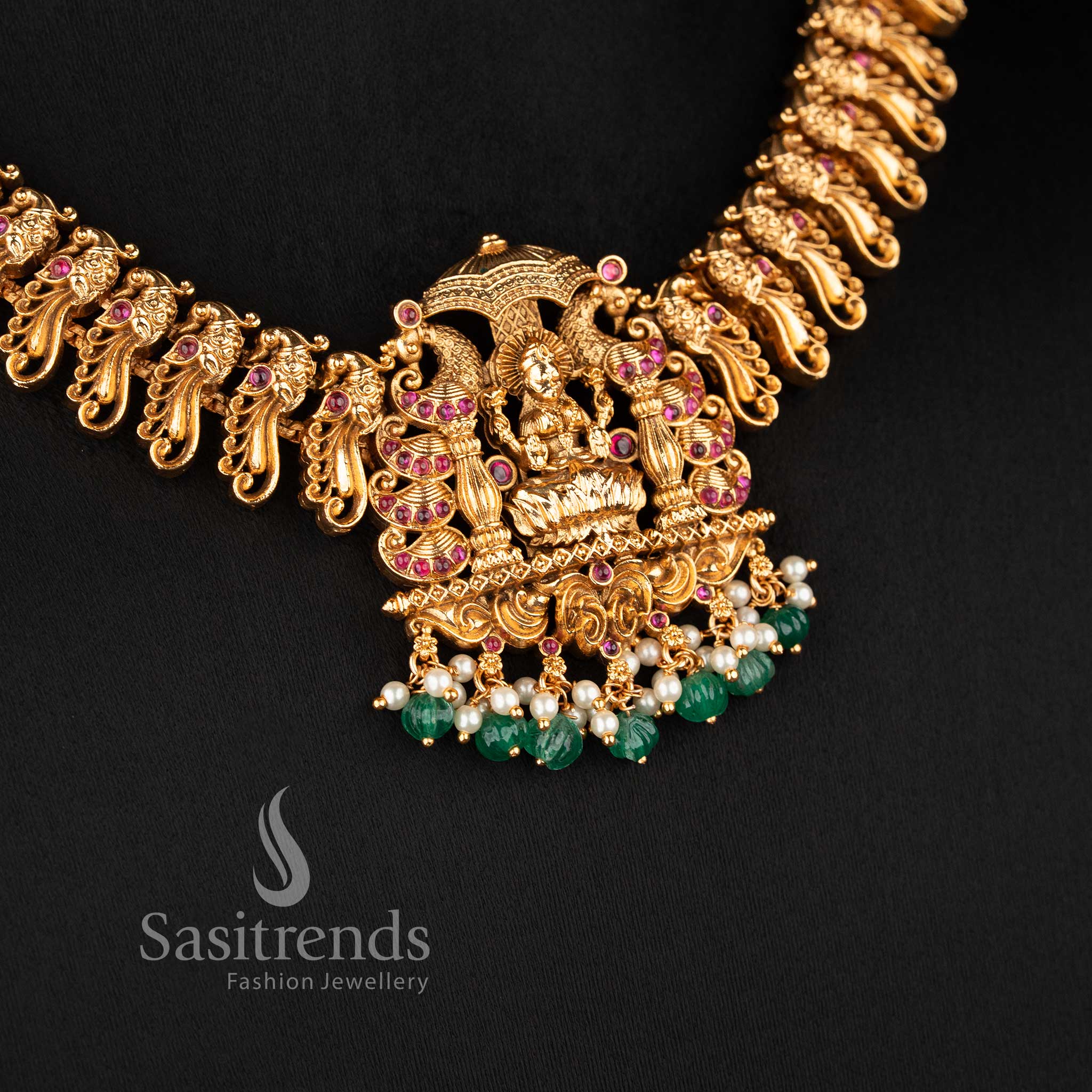 grand south indian bridal necklace with lakshmi and peacock motifs ruby green stone combination and bead hangings sasitrends