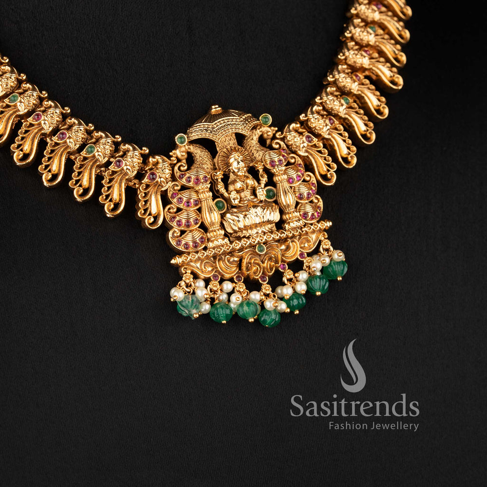 heavy bridal necklace set with intricate lakshmi peacock design ruby stone work and hanging beads for saree sasitrends