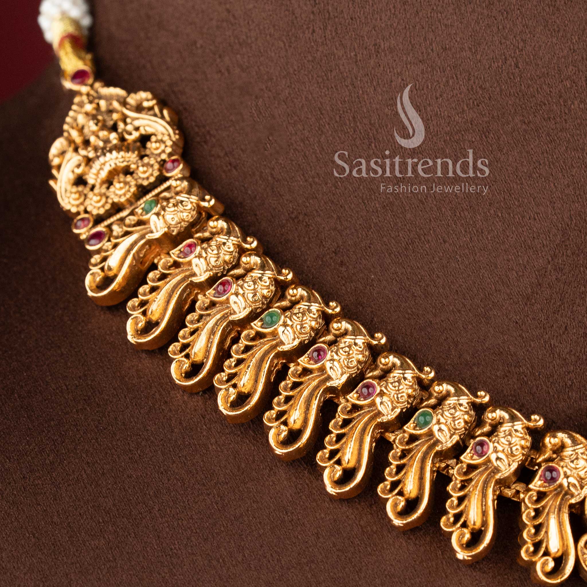 ethnic matte finish temple jewellery set with ruby green stones lakshmi pendant and traditional jhumkas for wedding wear sasitrends