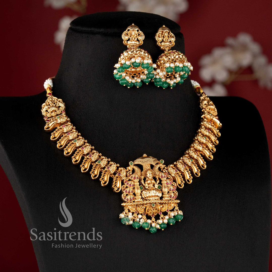 heavy bridal necklace set with intricate lakshmi peacock design ruby stone work and hanging beads for saree sasitrends