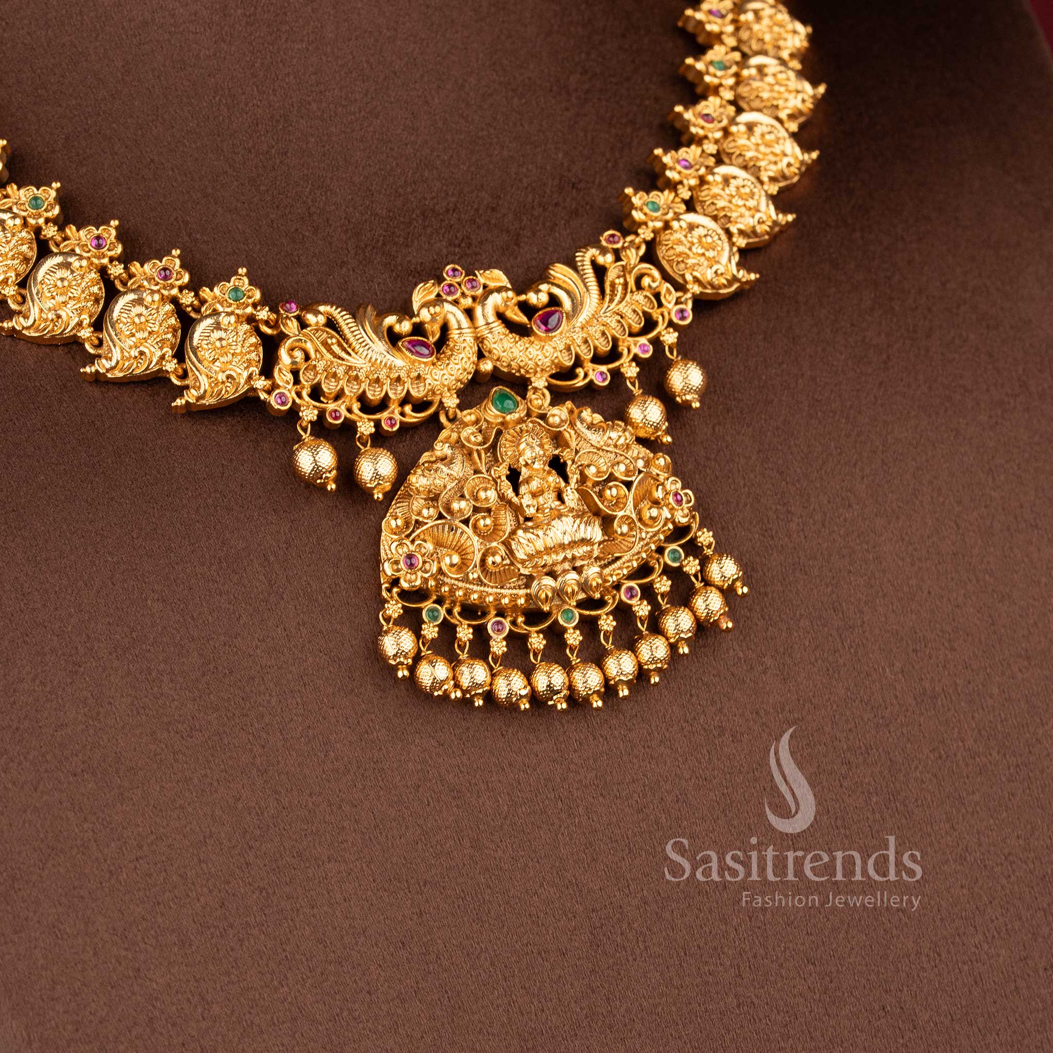 Traditional south indian jewellery set with lakshmi motif peacock design ruby green stone combination for bridal saree sasitrends