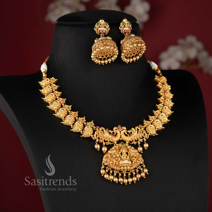 Temple matte gold plated lakshmi peacock bridal necklace set with ruby and green stones and grand pendant for wedding wear sasitrends3