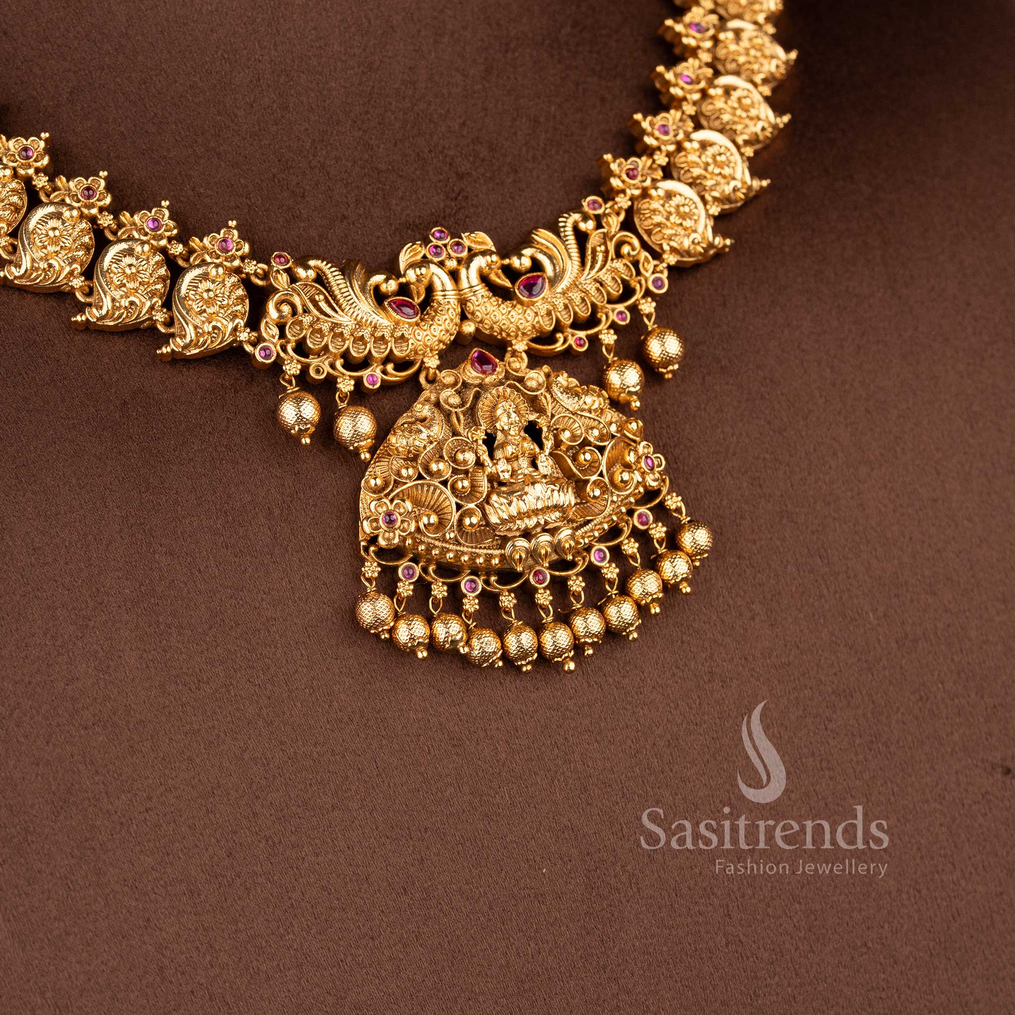 traditional south indian jewellery set with lakshmi motif peacock design and ruby stone detailing for bridal saree sasitrends