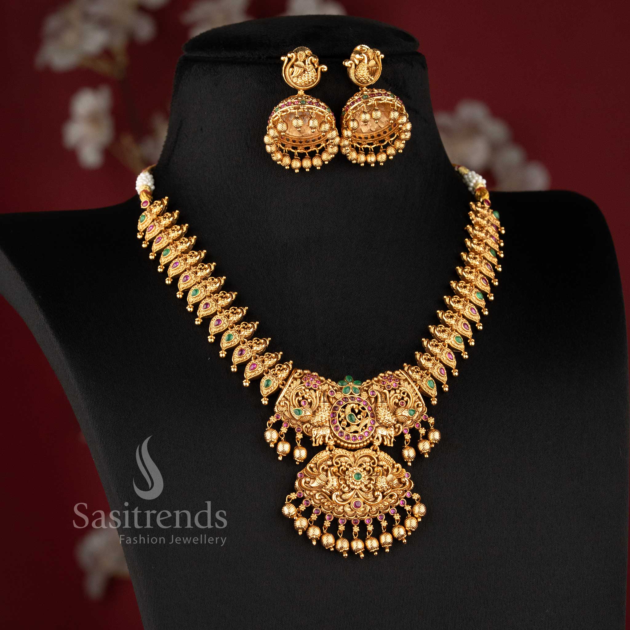 heavy bridal necklace set with temple design floral pattern central pendant and hanging beads for wedding wear sasitrends