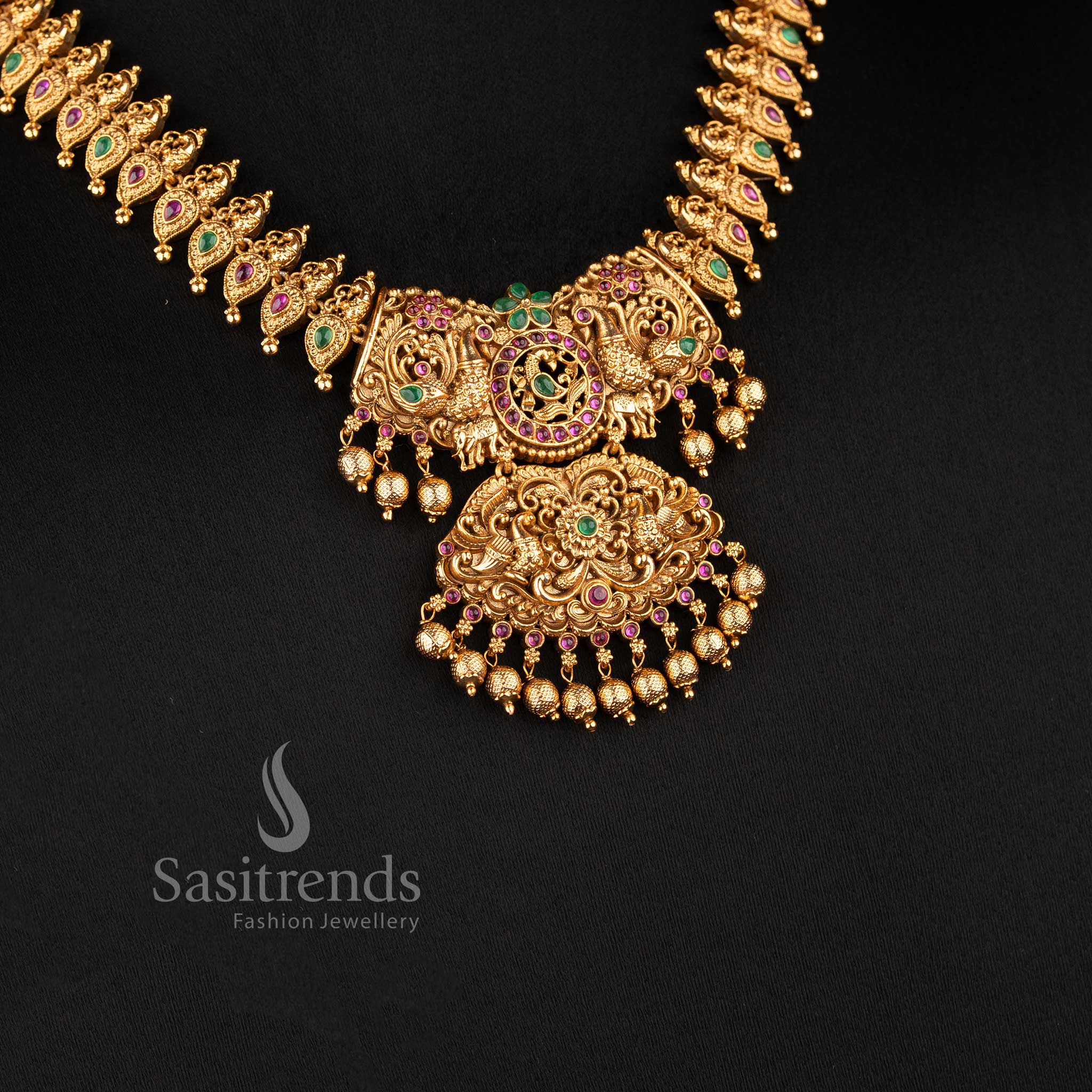 temple matte gold plated lakshmi floral bridal necklace set with detailed pendant and jhumka earrings sasitrends
