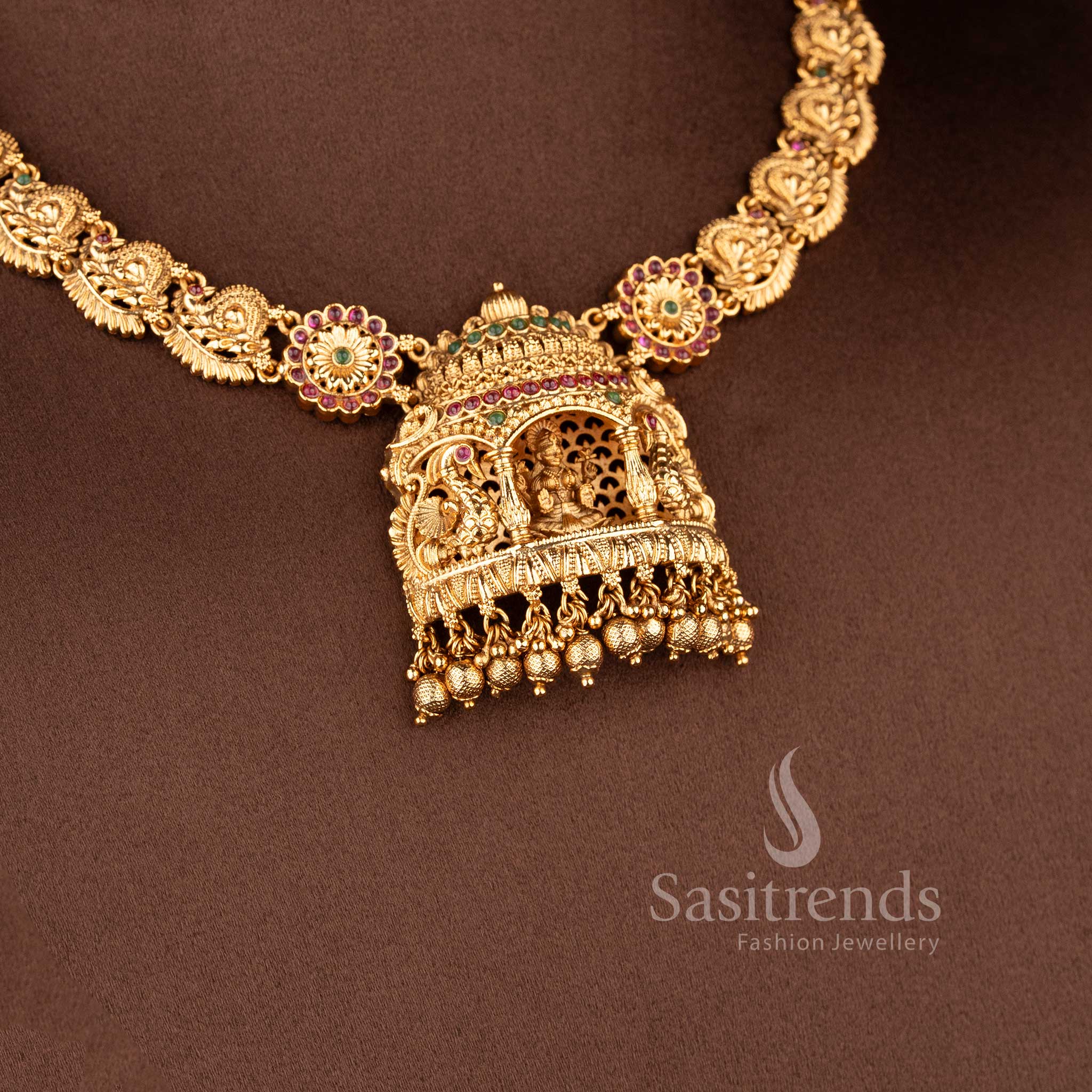Grand Temple Jewellery Set for brides featuring a massive Lakshmi courtyard pendant and peacock-linked choker band - Sasitrends"