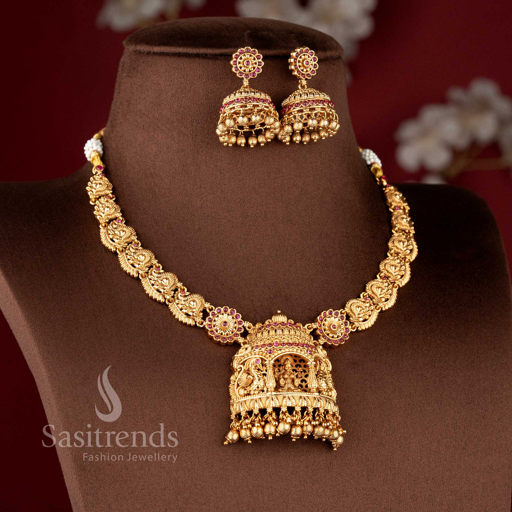 Detailed view of the large architectural deity pendant and matching dome jhumkas from the temple jewellery for wedding collection - Sasitrends