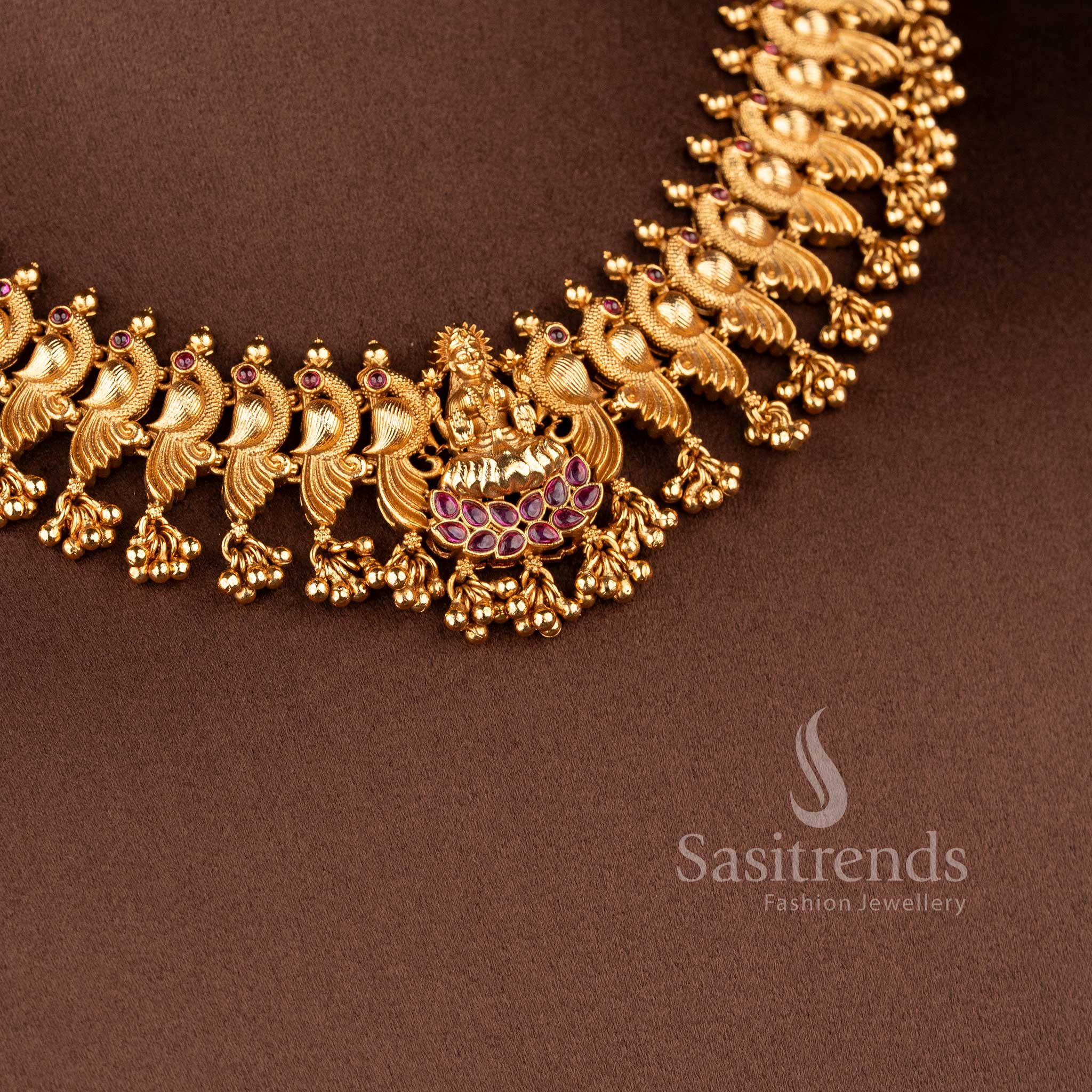 Grand Temple Jewellery Set for brides featuring a seated Lakshmi pendant on a lotus base and dancing peacock-motif links - Sasitrends