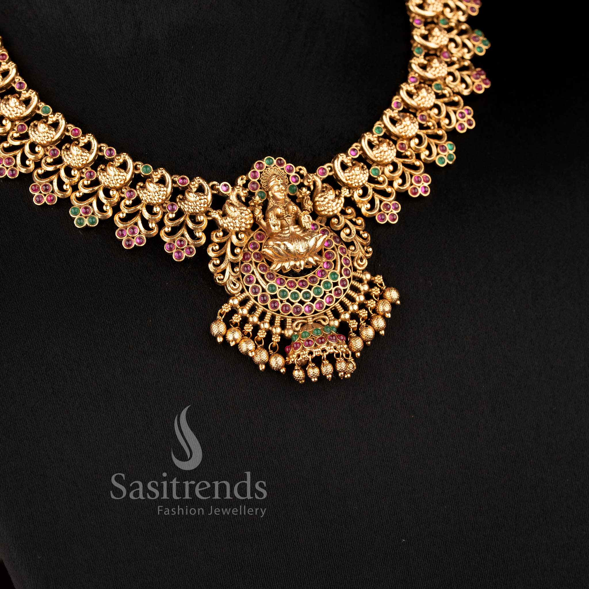 Traditional deity-stud jhumkas with stone-studded domes and gold bead drops from the temple jewellery for marriage collection - Sasitrends