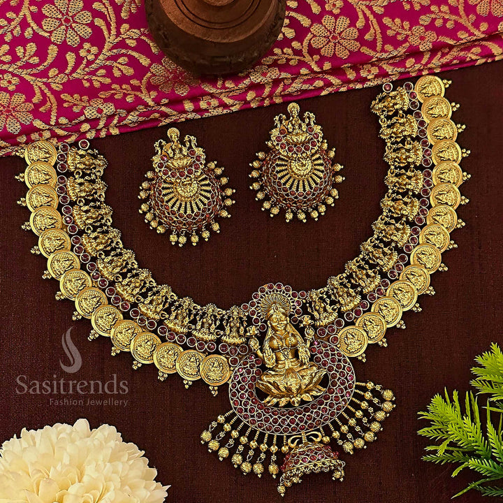 Latest bridal temple choker set crafted in matte gold plating, featuring detailed Lakshmi coin motifs and glimmering ruby stone accents, perfect for South Indian wedding elegance – sasitrends
