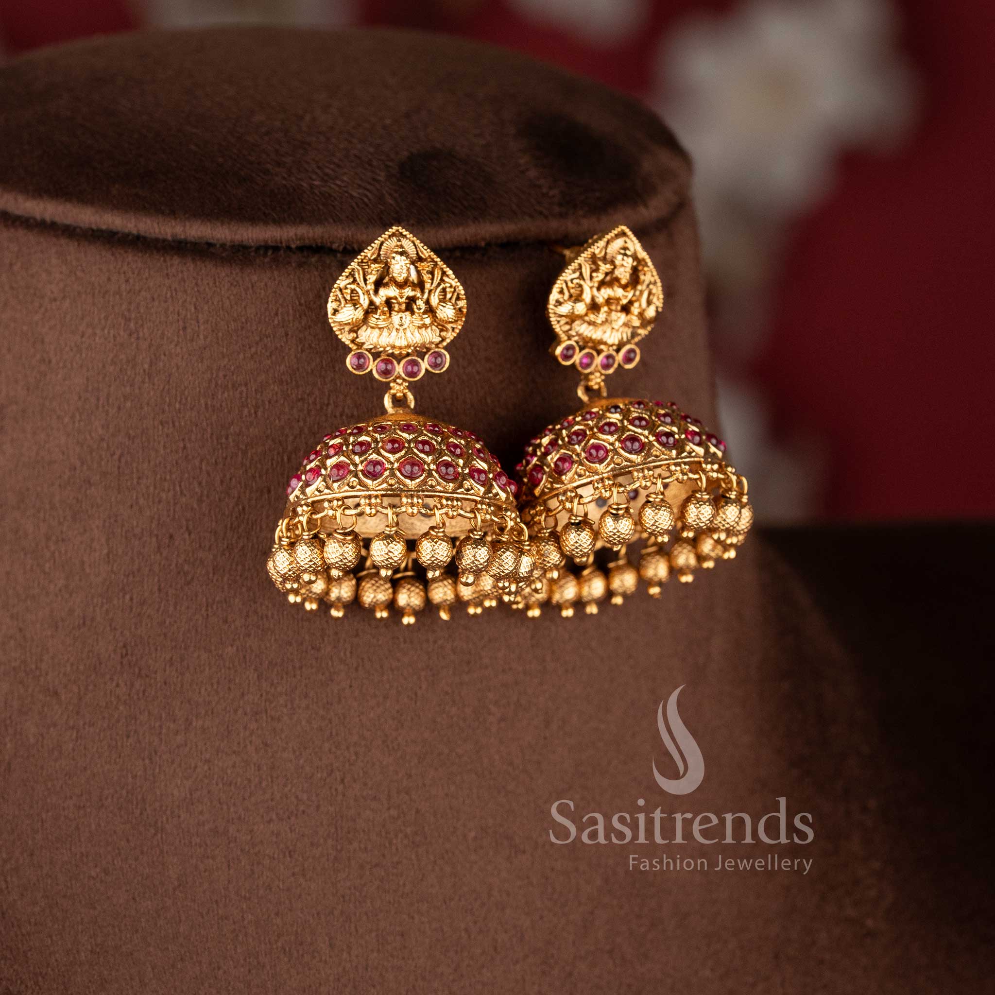 Traditional bridal wear temple matte gold tone Lakshmi and peacock haram necklace jewellery set in ruby color with matching jhumkas by Sasitrends, perfect for wedding and festive occasions - Sasitrends