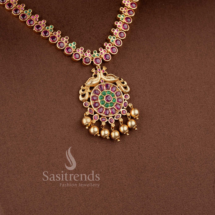 Traditional Nakshi style temple jewellery set with ruby Kemp peacock necklace in matte gold finish by Sasitrends for saree and bridal wear