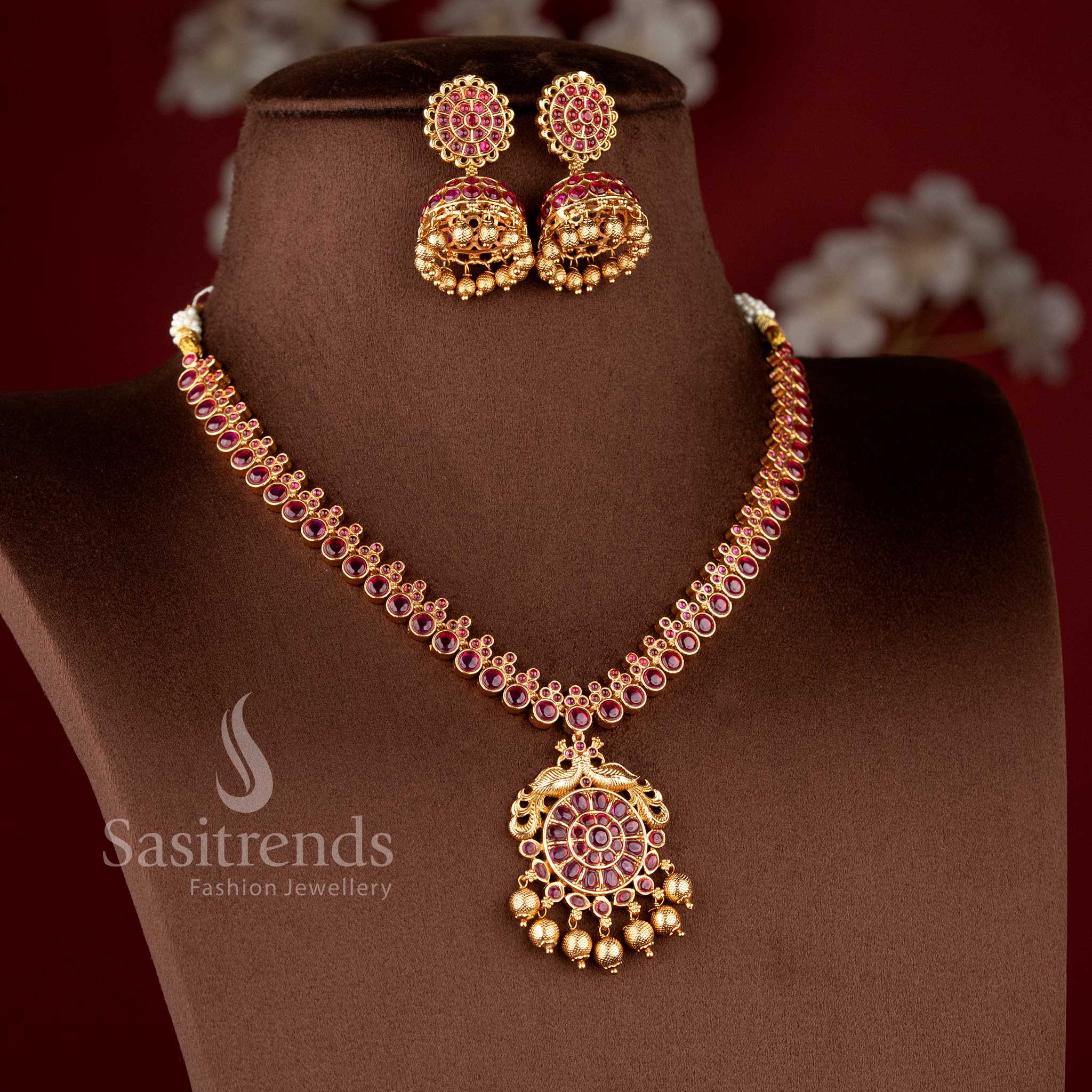 Traditional Nakshi style temple jewellery set with ruby Kemp peacock necklace in matte gold finish by Sasitrends for saree and bridal wear