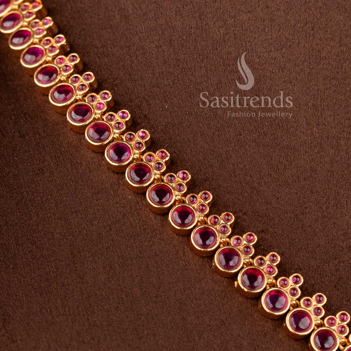 Heavy bridal temple matte gold necklace with ruby Kemp stones and detailed peacock design by Sasitrends, ideal for festive and bridal look