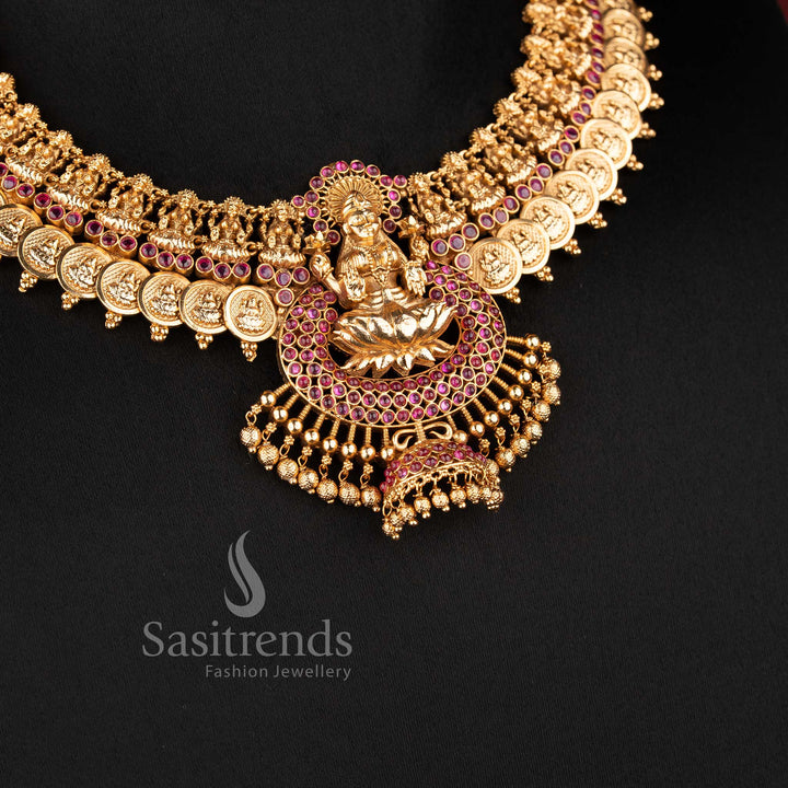 Grand bridal wear temple matte gold finish Lakshmi lotus and kasu necklace jewellery set in ruby green color by Sasitrends, perfect for wedding and festive occasions