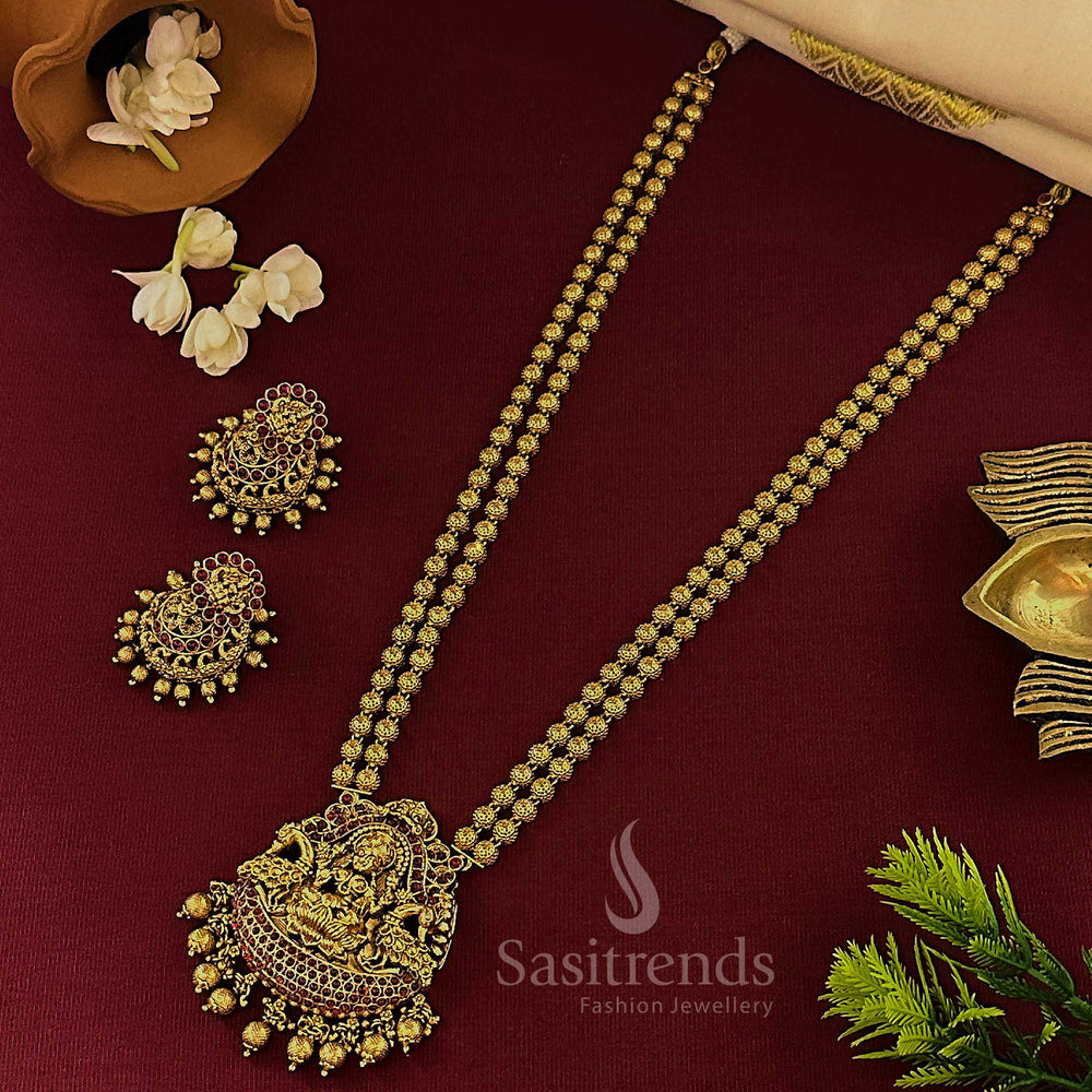 Heritage-inspired matte gold temple long jewellery set with Lakshmi pendant, double ruby bead layering and classic jhumkas—ideal for the South Indian bridal haram style look – sasitrends