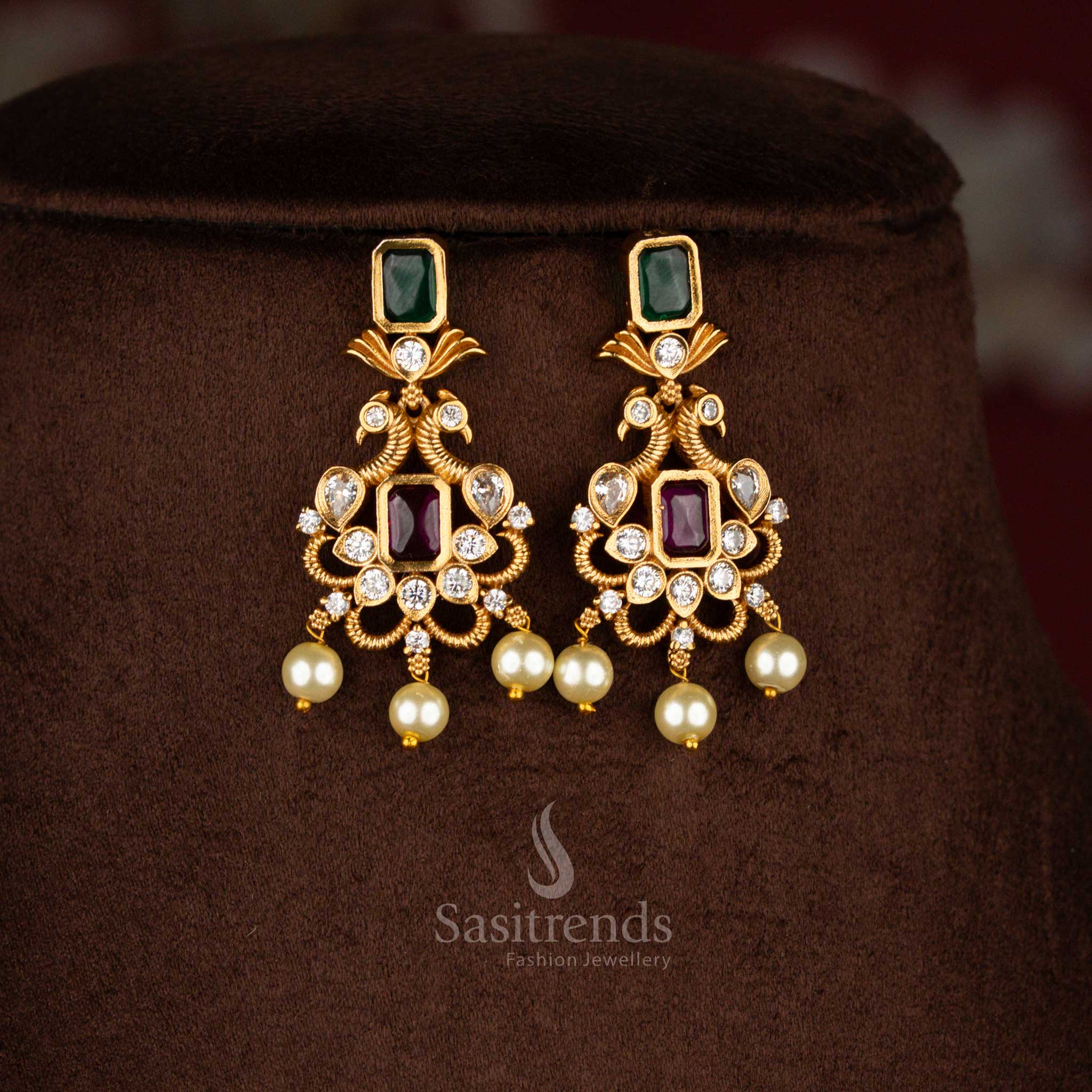 Traditional ruby-green AD crystal stones temple choker jewellery set with iconic peacock centrepiece, matte gold finish and sparkling – Sasitrends