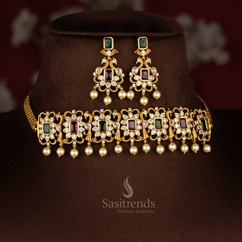 ruby-green combination temple choker jewellery set with iconic peacock centrepiece, matte gold finish and sparkling AD crystal stones for celebration style – Sasitrends