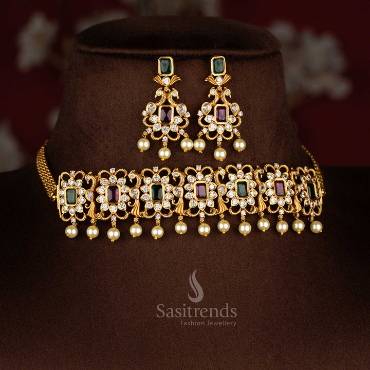 ruby-green combination temple choker jewellery set with iconic peacock centrepiece, matte gold finish and sparkling AD crystal stones for celebration style – Sasitrends
