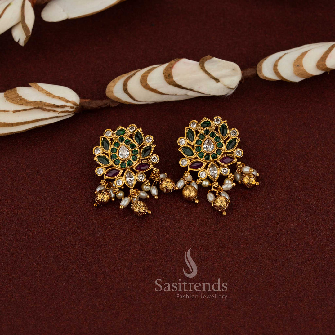 Traditional Earrings with Graceful Temple matte Gold Plated Lotus Floral Design, Kemp AD Stones in Ruby, green & White, Pearls, and Bead Hangings