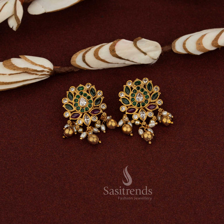 Traditional Earrings with Graceful Temple matte Gold Plated Lotus Floral Design, Kemp AD Stones in Ruby, green & White, Pearls, and Bead Hangings