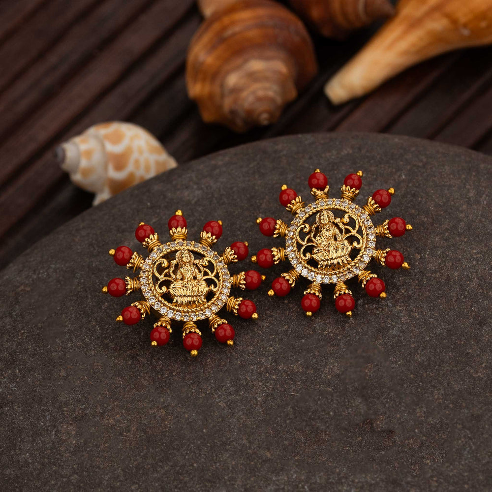 Royal Matte Gold Plated Lakshmi Temple Stud Earrings Featuring Rich Red Pearl Drops And Sparkling AD Stone Details, A Festive Statement Jewellery Design With Majestic Ethnic Appeal – Sasitrends