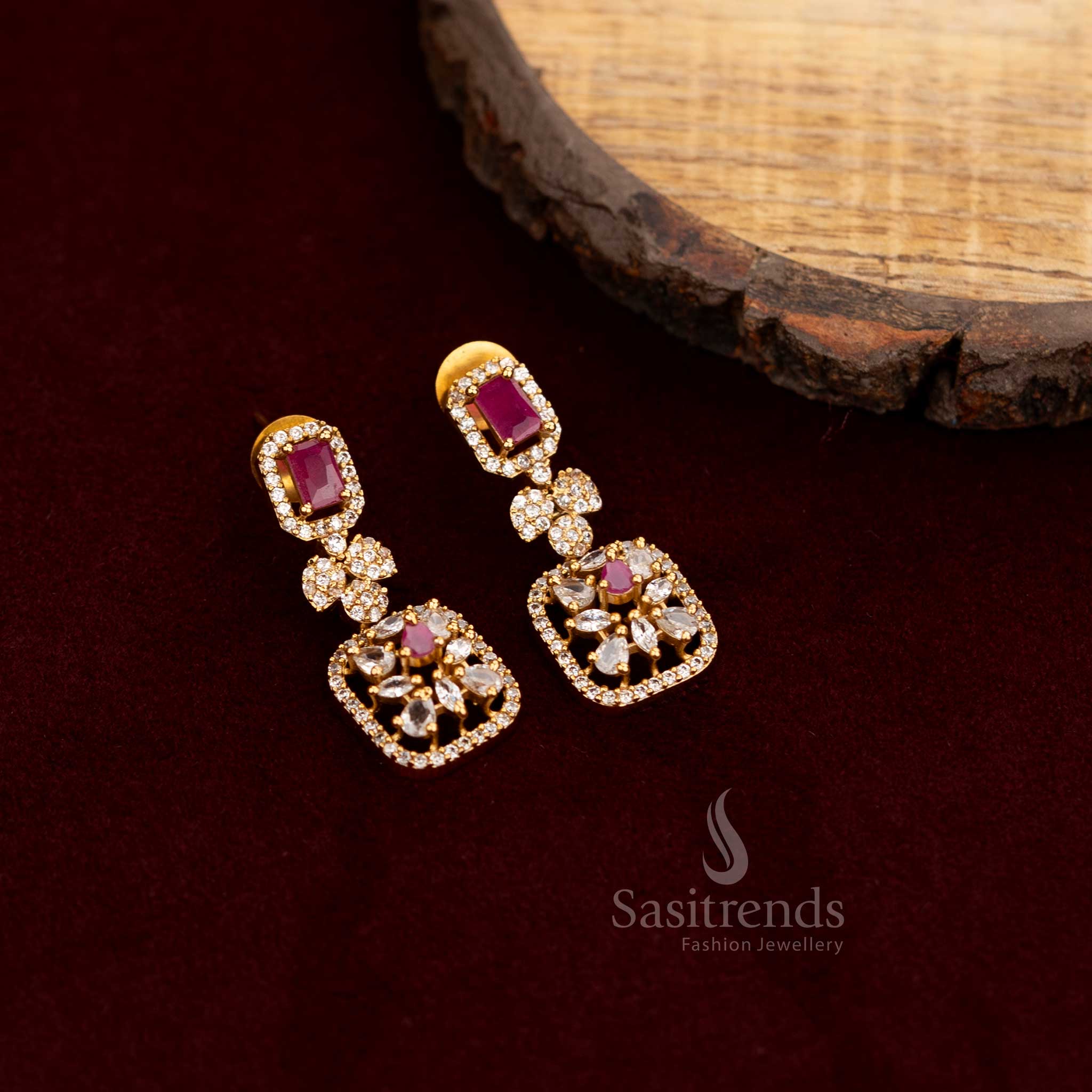 Elegant American Diamond long drop earrings with sparkling white and ruby stones, featuring a multi-structured design, perfect for lavish party wear jewellery ensembles - Sasitrends
