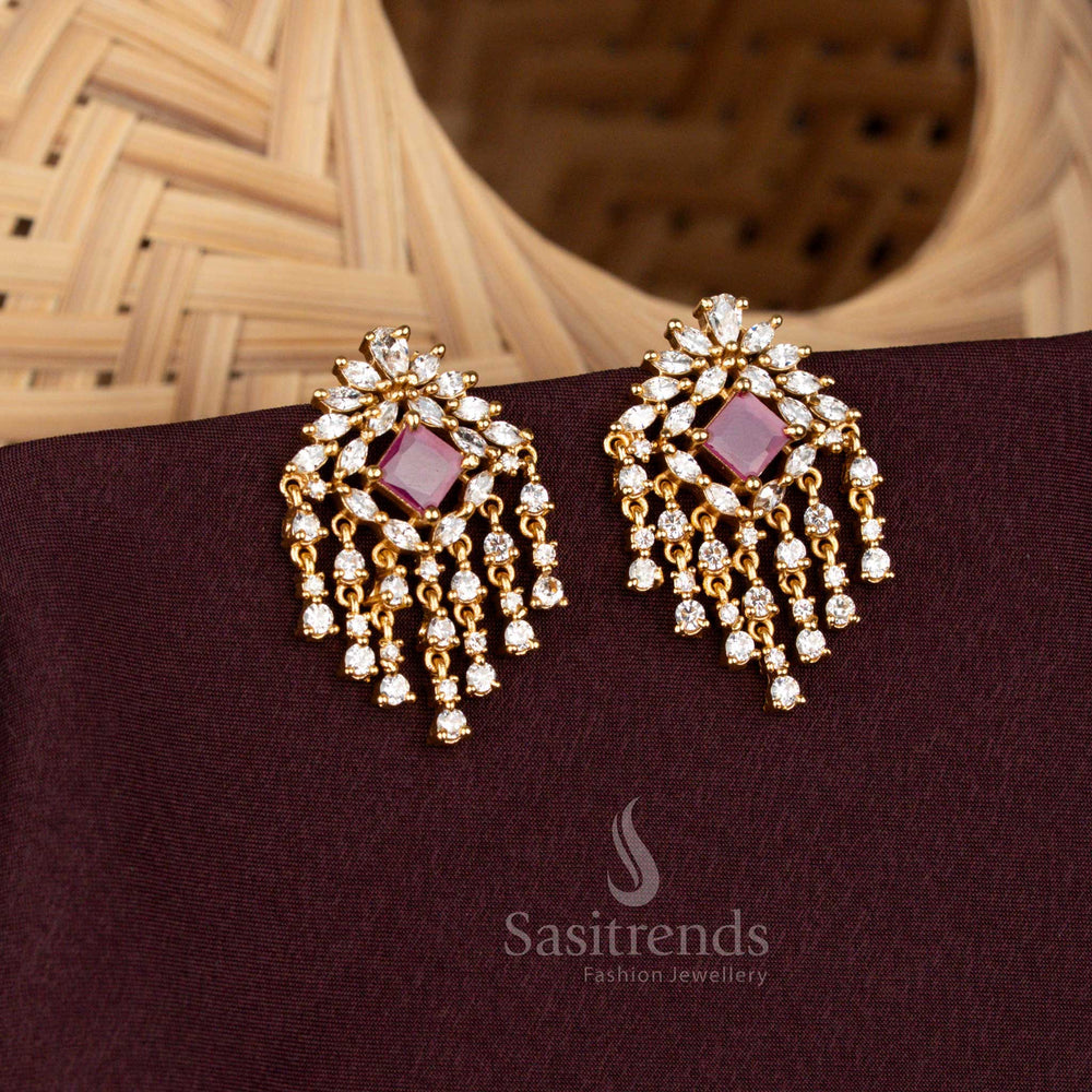 Stylish matte gold plated floral and geometric stud earrings adorned with white and ruby American diamonds finished with a cascading dangler design – Sasitrends