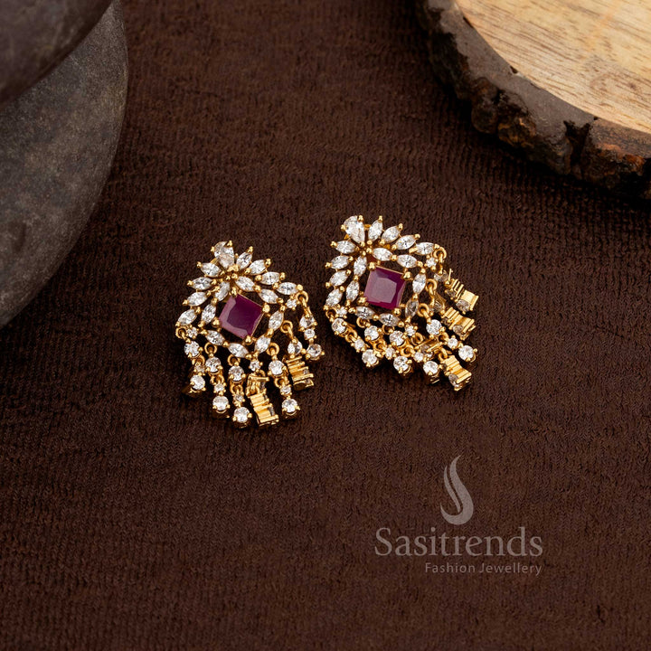 Stylish matte gold plated floral and geometric stud earrings adorned with white and ruby American diamonds finished with a cascading dangler design – Sasitrends
