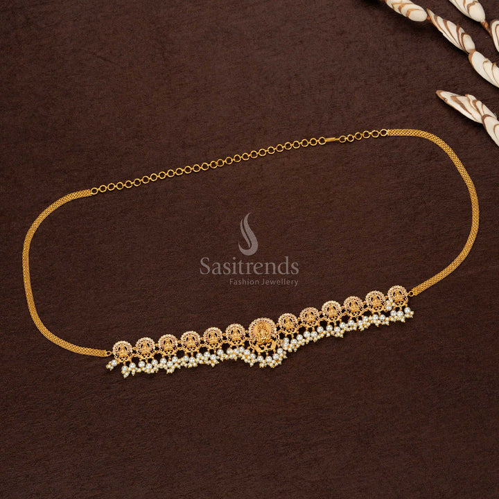 Magnificent premium temple matte gold plated hip belt featuring an intricate Lakshmi engraving with full pearl adornment, an epitome of regal wedding jewellery - Sasitrends
