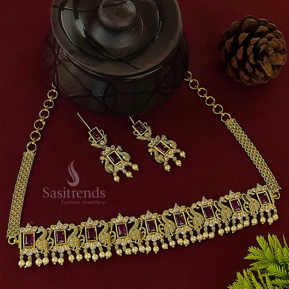 Stunning traditional matte gold plated peacock choker set, intricately designed with radiant ruby red stones and delicate pearls, perfect for women seeking an opulent and timeless look from Sasitrends