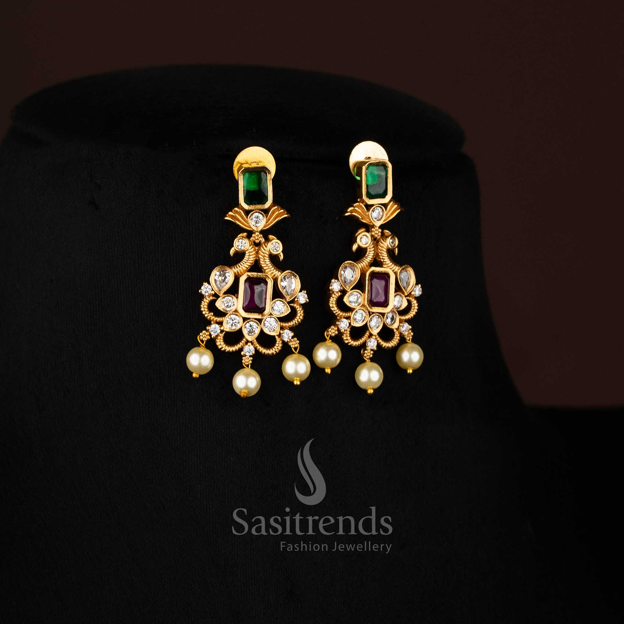 Matte gold plated peacock choker necklace, showcasing an elegant combination of deep ruby Green and accents and dangling pearls, ideal for festive occasions from Sasitrends