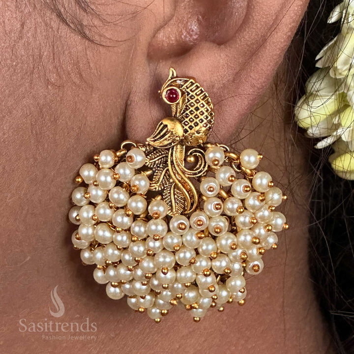 Exquisite temple matte gold plated earrings in a peacock cluster style, designed with vintage temple detailing for grand bridal wear and eternal Indian jewellery elegance – sasitrends
