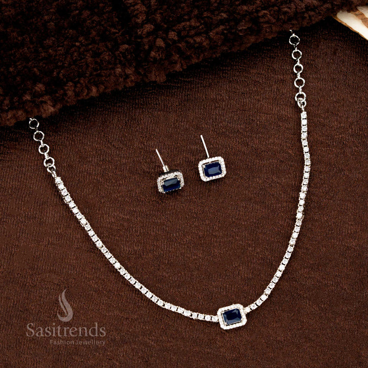 Deep blue American diamond rectangle necklace set with rhodium silver layer and glittering earrings – a luxurious and rich-toned jewellery design for evening wear by Sasitrends