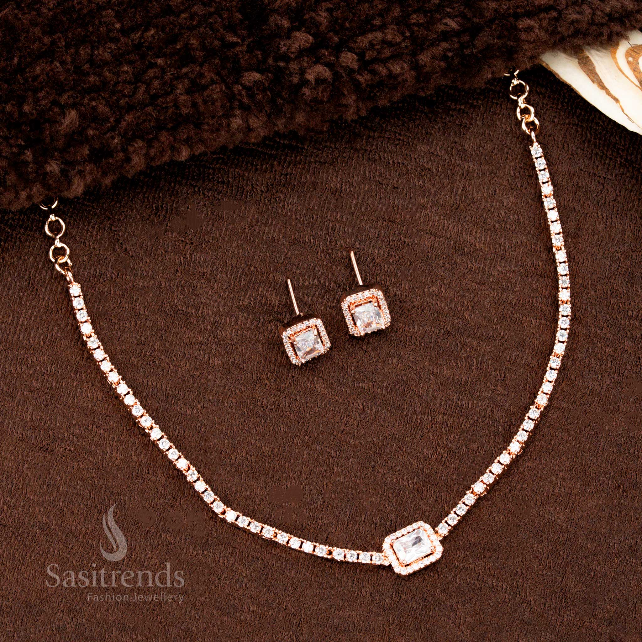 Rose gold plated necklace set with brilliant white rectangular American diamond pendant and sparkling earrings – an elegant statement jewellery piece for wedding or party wear by Sasitrends