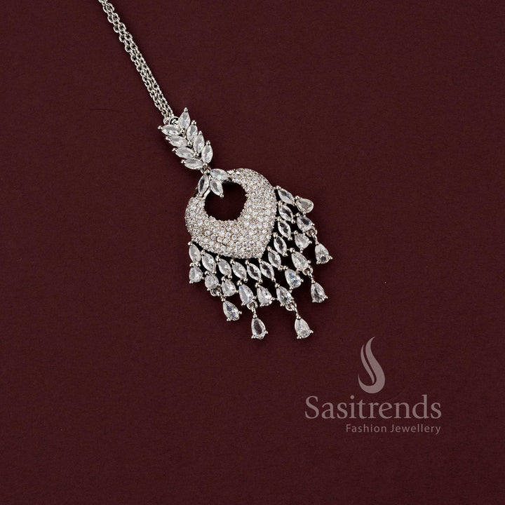 Elegant all-white American Diamond maang tikka 2129F with a spade-style motif and a wide fringe of clear teardrop stones, a versatile accessory for party wear sarees and formal events.