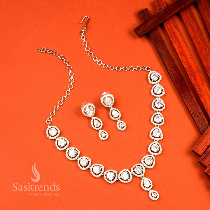 White rhodium silver jewellery set featuring oval shapes and brilliant American diamond stones for a chic and ethereal party wear appeal – Sasitrends

