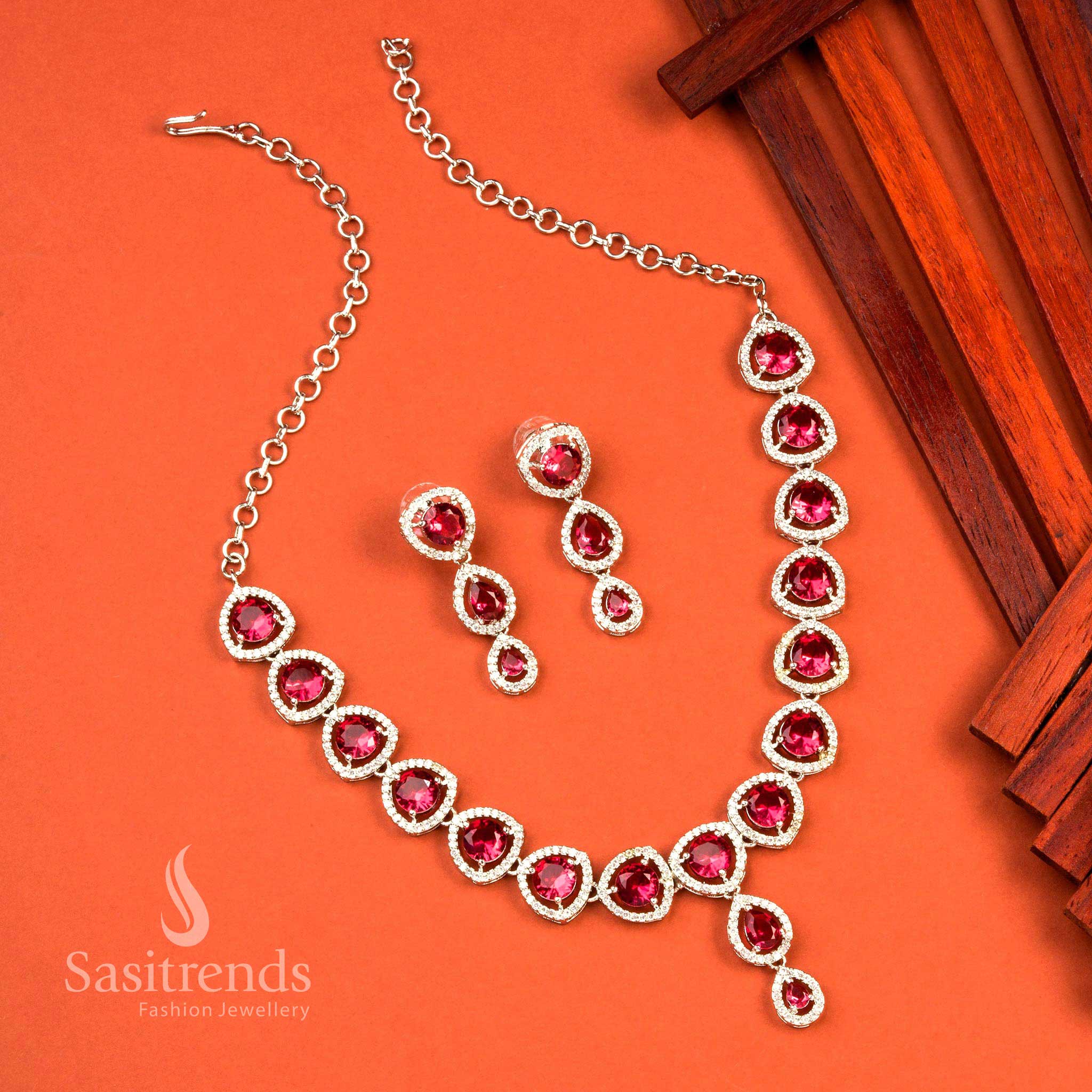 Bold red rhodium finish jewellery set with oval American diamond accents, designed for glamorous party looks and statement wear – Sasitrends
