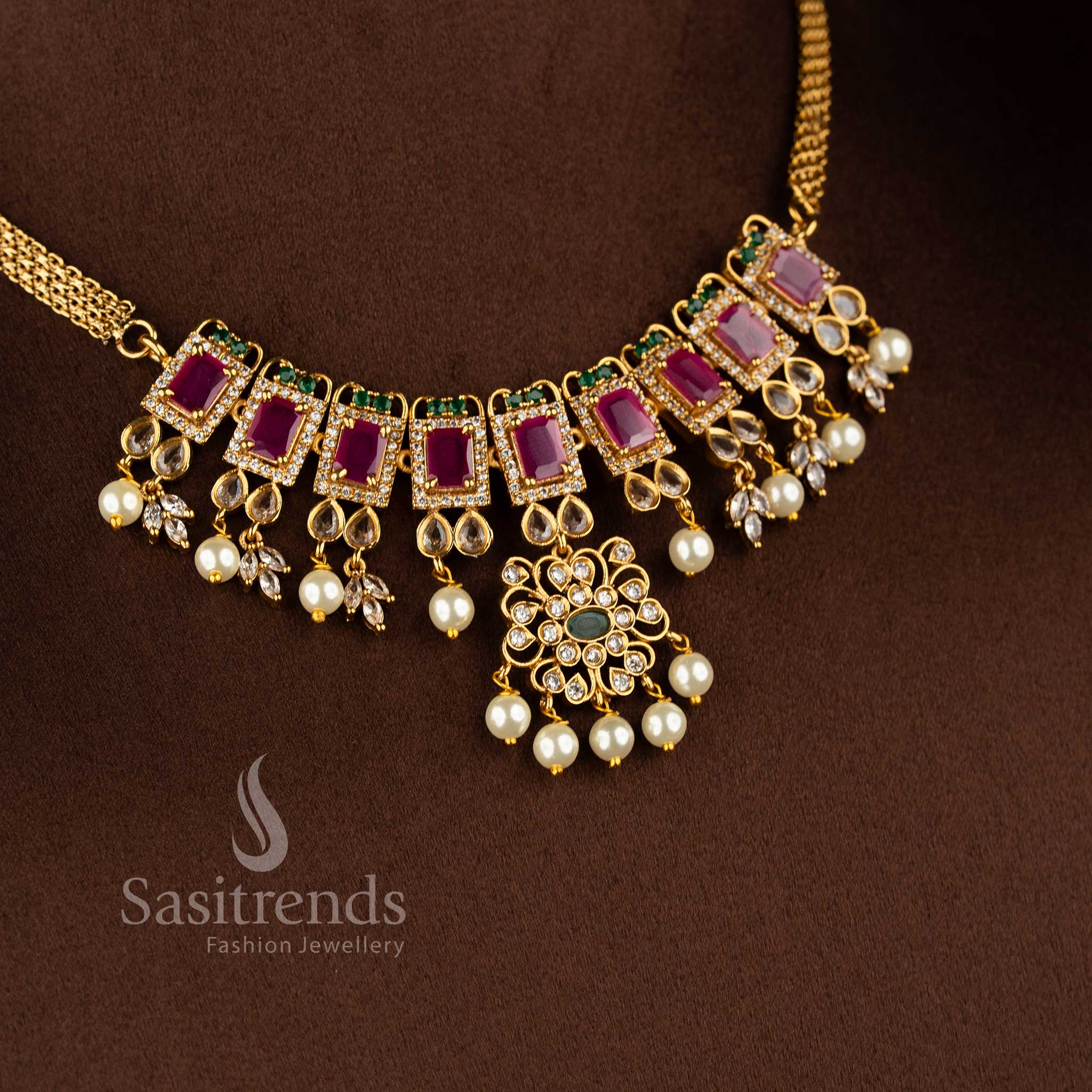 Matte gold plated floral choker necklace set with AD stones and pearl detailing by Sasitrends.