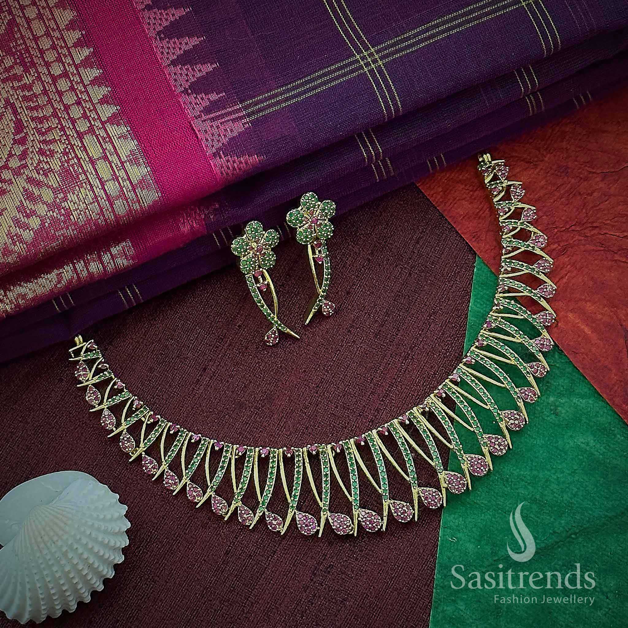Ruby and green floral temple choker jewellery set with dual-tone kemp stones in matte gold finish – ideal for traditional style and festive charm – Sasitrends