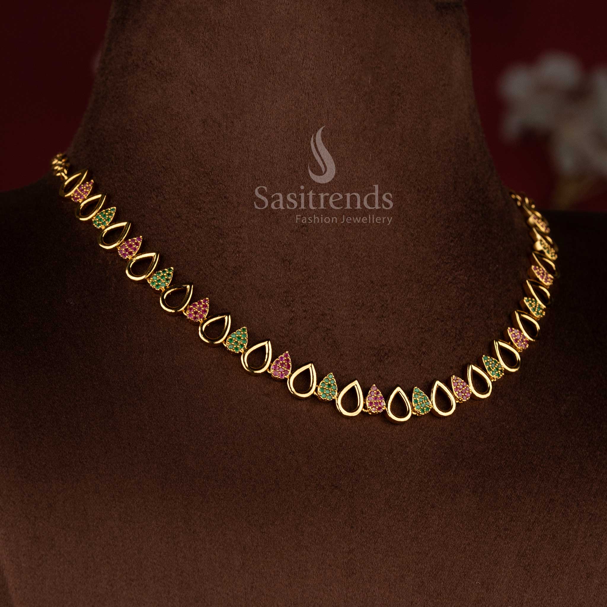 Matte gold AD jewellery set with elegant pear-shaped centrepiece