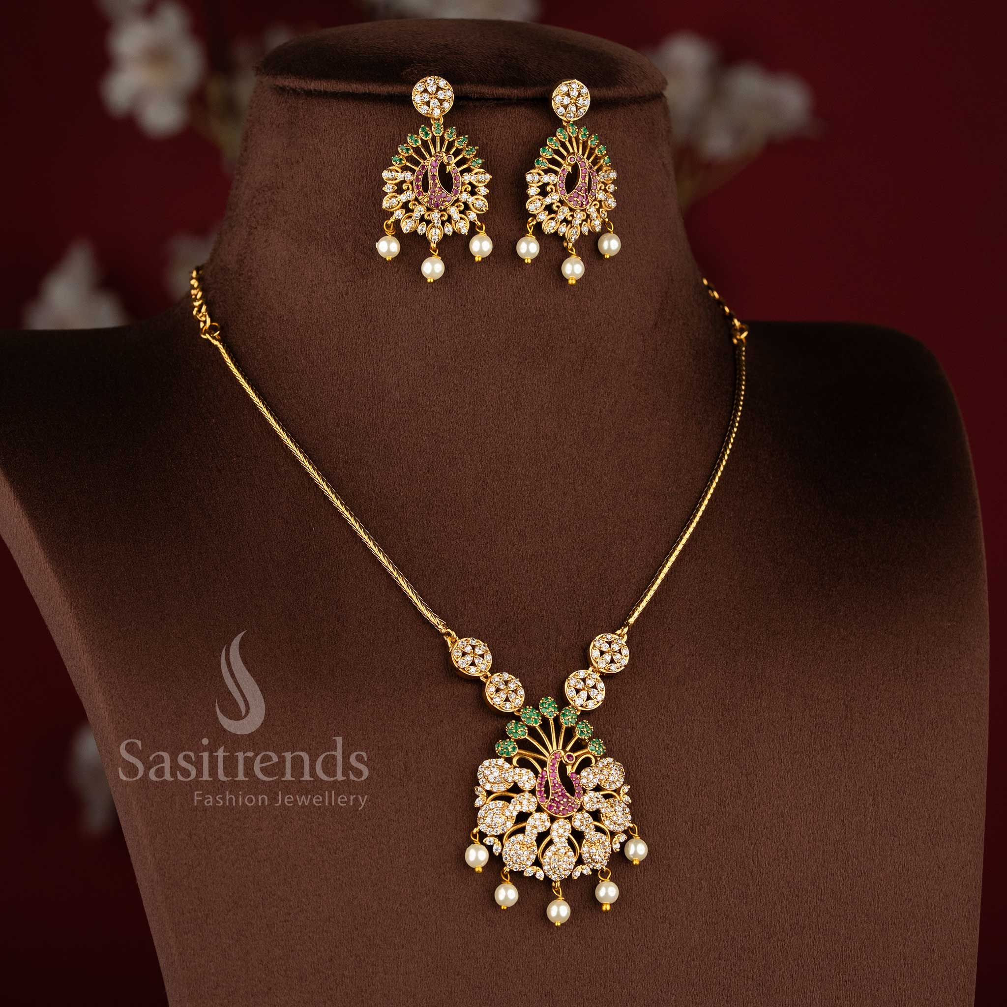 Trendy party wear temple matte gold plated peacock AD necklace jewellery set for women by Sasitrends.
