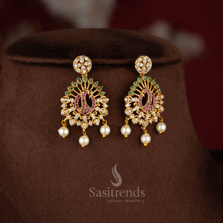 Traditional matte gold peacock design necklace set with American diamond stones for festive wear.