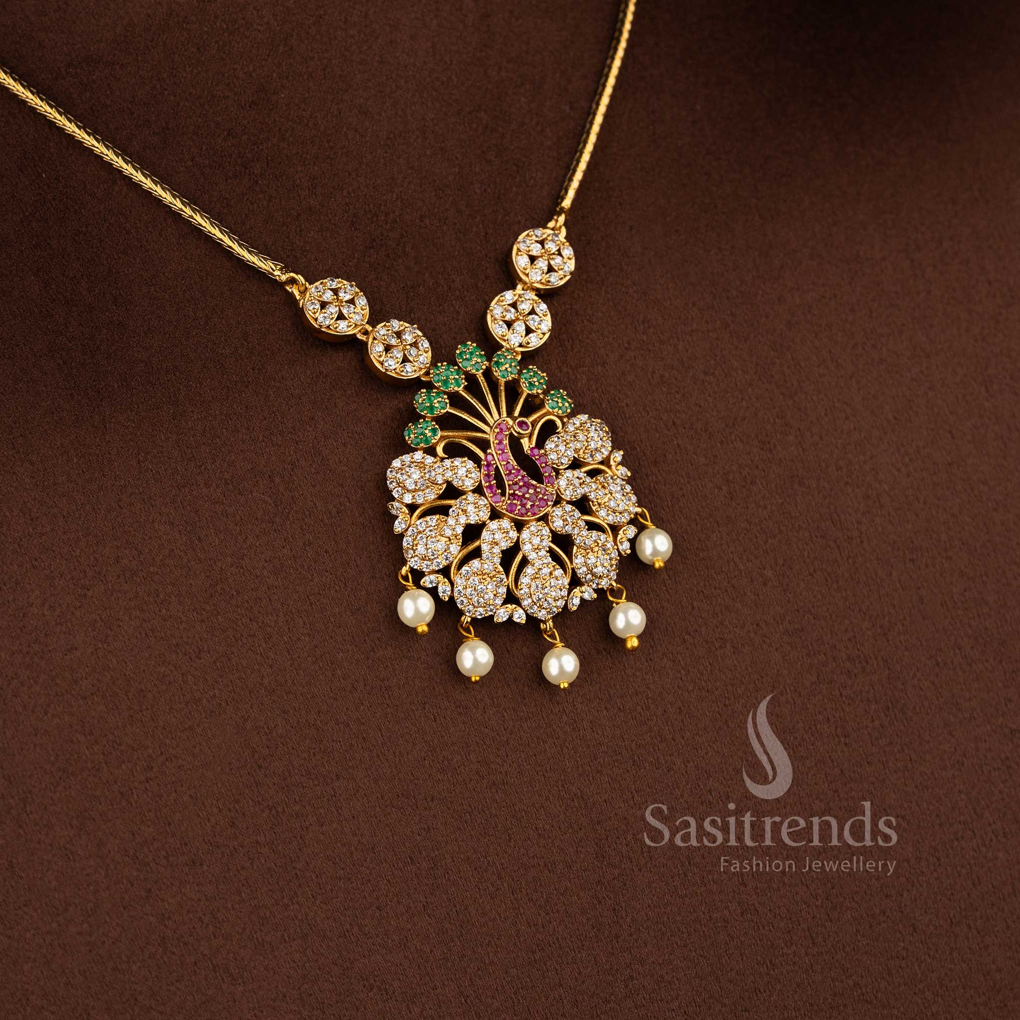 Traditional matte gold peacock design necklace set with American diamond stones for festive wear.