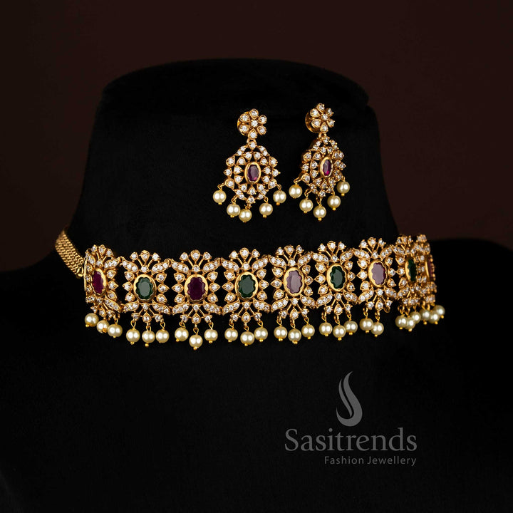 Vibrant ruby Green stone floral choker jewellery set with temple matte gold plating, pearl-laced contours, and artistic AD sparkle, perfect for celebratory occasions – Sasitrends