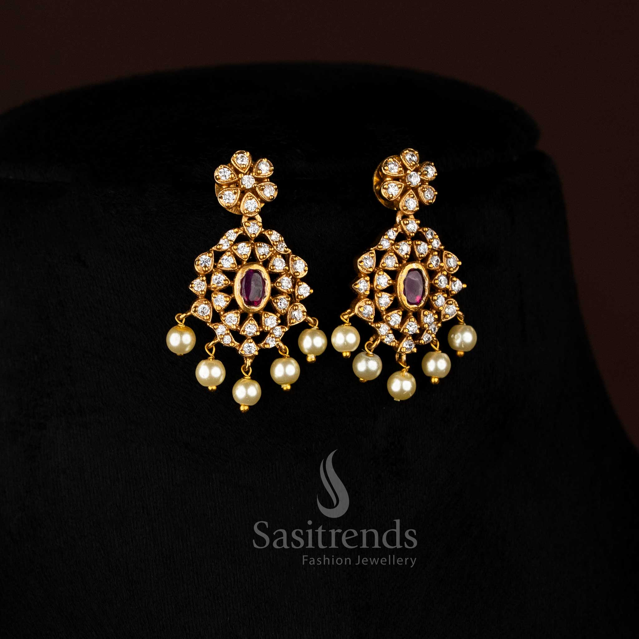 Vibrant ruby stone floral choker jewellery set with temple matte gold plating, pearl-laced contours, and artistic AD sparkle, perfect for celebratory occasions – Sasitrends