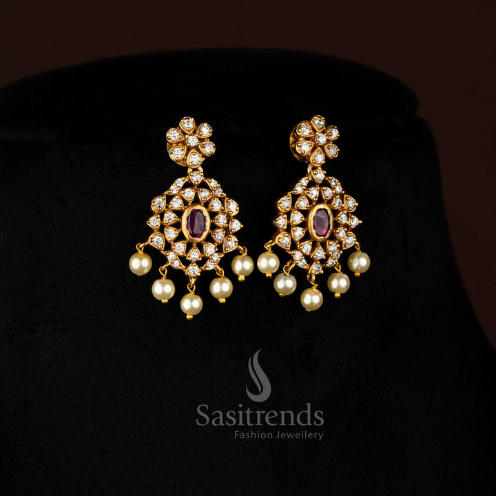 Vibrant ruby stone floral choker jewellery set with temple matte gold plating, pearl-laced contours, and artistic AD sparkle, perfect for celebratory occasions – Sasitrends