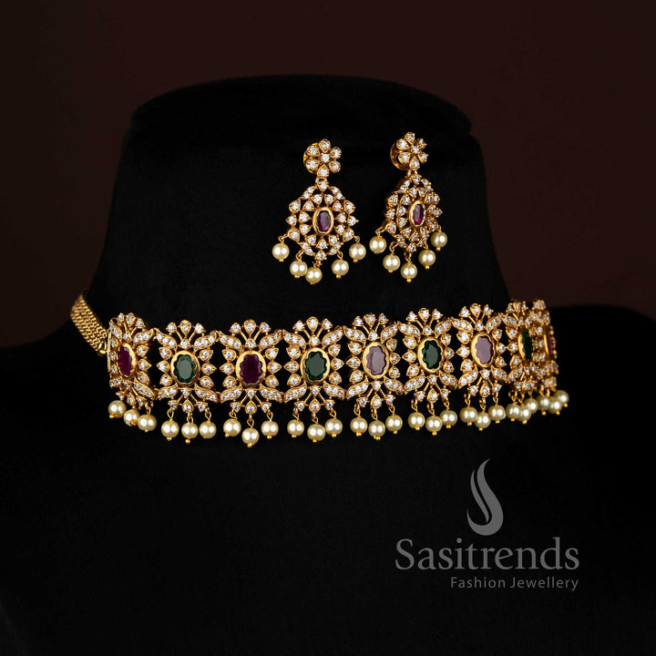 Vibrant ruby Green stone floral choker jewellery set with temple matte gold plating, pearl-laced contours, and artistic AD sparkle, perfect for celebratory occasions – Sasitrends