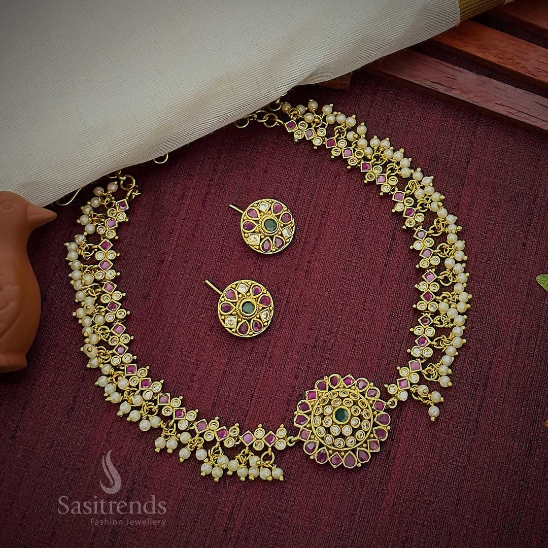 Vibrant multicolour temple choker jewellery set with radiant floral pendant, dazzling AD stone accents, and graceful pearl drops finished in rich matte gold – Sasitrends