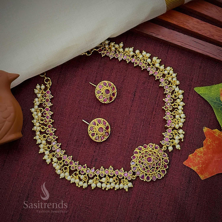 Royal ruby temple matte gold choker jewellery set adorned with a divine floral pendant, sparkling AD crystals, and luxurious pearl drop charm – Sasitrends